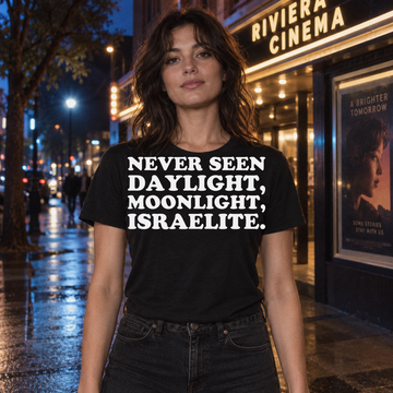 AI-generated lifestyle visualization of a person wearing the Never Seen Daylight black quote T-shirt outside a cinema at night