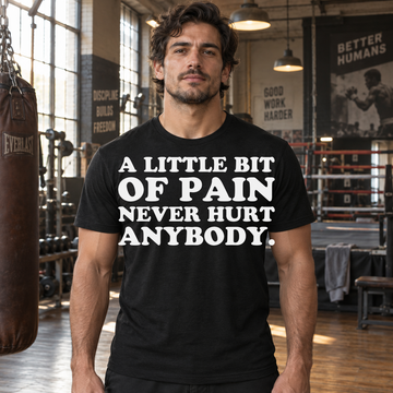 AI-generated lifestyle visualization of a person wearing the A Little Bit of Pain black quote T-shirt in a classic boxing gym