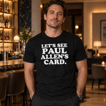 AI-generated lifestyle visualization of a person wearing the black tri-blend Let's See Paul Allen's Card quote T-shirt