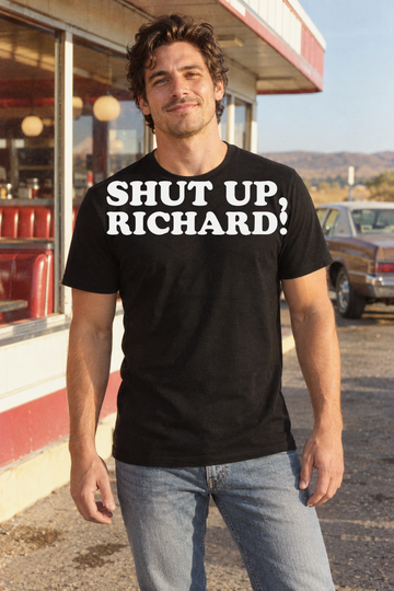 AI-generated lifestyle visualization: person wearing the black tri-blend Shut Up, Richard! quote T-shirt in a roadside diner parking lot