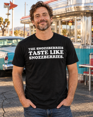 AI-generated lifestyle visualization of a person wearing the The Snozzberries Taste Like Snozzberries. black tri-blend quote T-shirt at a roadside diner