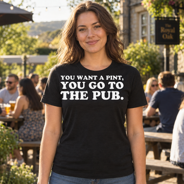 AI-generated lifestyle visualization of a person wearing the You Want a Pint black quote T-shirt in a sunny pub garden