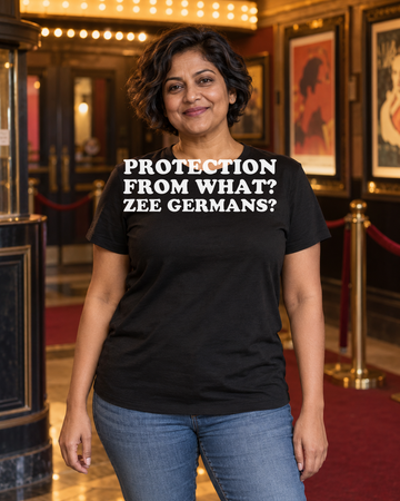 AI-generated lifestyle visualization of a person wearing the Protection from What? Zee Germans? black tri-blend quote T-shirt in an independent cinema lobby