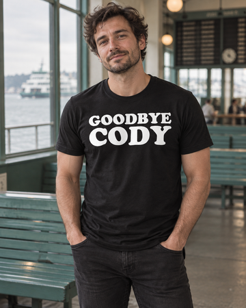 AI-generated lifestyle visualization: person wearing the black tri-blend Goodbye Cody quote T-shirt at a ferry terminal