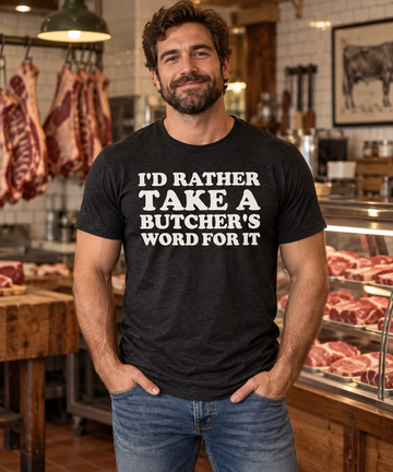 AI-generated lifestyle visualization: person wearing the black tri-blend I'd Rather Take a Butcher's Word for It quote T-shirt in an old-school butcher shop