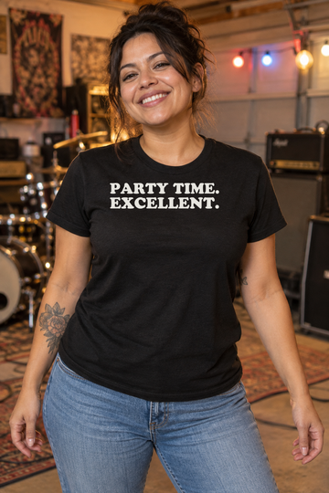 AI-generated lifestyle visualization: person wearing the black tri-blend Party Time. Excellent. quote T-shirt in suburban garage rehearsal space with amps turned away, colored bulbs, and no visible brands