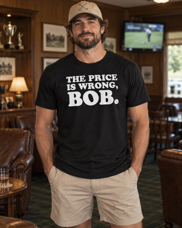 AI-generated lifestyle visualization: person wearing the black tri-blend The Price Is Wrong, Bob. quote T-shirt in a retro municipal golf clubhouse lounge with a muted television glow and no visible logos