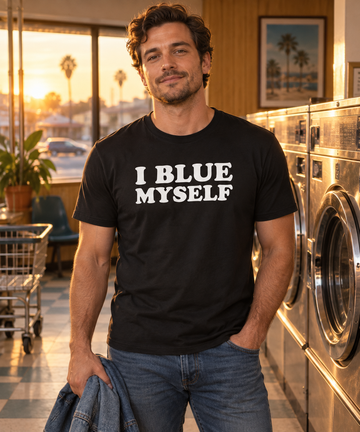 AI-generated lifestyle visualization: person wearing the black tri-blend I Blue Myself quote T-shirt in a neighborhood laundromat