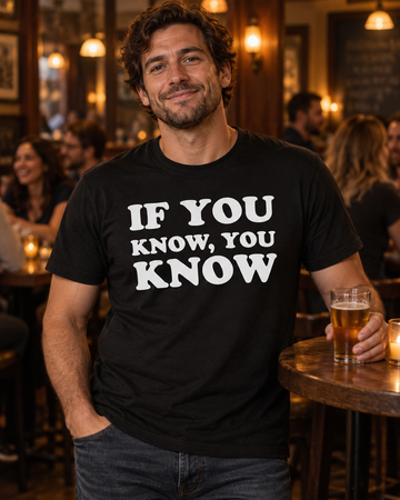 AI-generated lifestyle visualization: person wearing the black tri-blend If You Know, You Know Quote Club T-shirt at a neighborhood pub trivia night