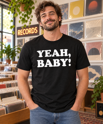 AI-generated lifestyle visualization: person wearing the black tri-blend Yeah, Baby! quote T-shirt in a record store