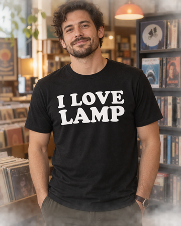 AI-generated lifestyle visualization: person wearing the black tri-blend I Love Lamp quote T-shirt in an independent video and record shop