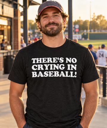AI lifestyle visualization: person wearing a black tri-blend There's No Crying in Baseball! quote T-shirt at a baseball field