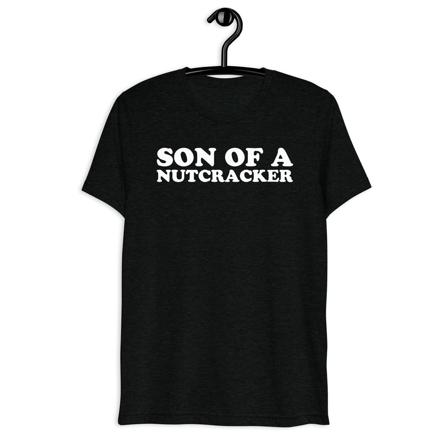 Son of a Nutcracker white quote print on a black tri-blend t-shirt, front hanger view