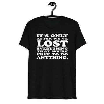 Front hanger mockup of the black tri-blend It's Only After We've Lost Everything That We're Free to Do Anything quote T-shirt