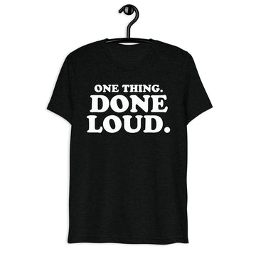 Front hanger mockup of the black tri-blend One Thing. Done Loud. Quote Club T-shirt