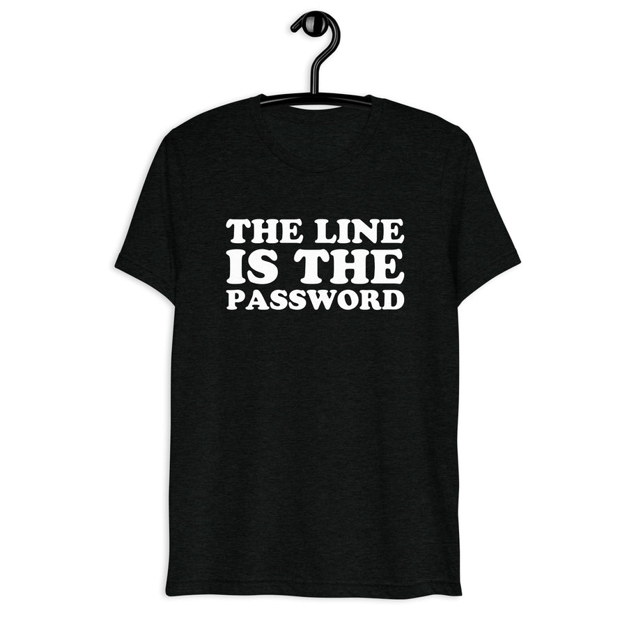 Front hanger mockup of the black tri-blend The Line Is the Password quote T-shirt