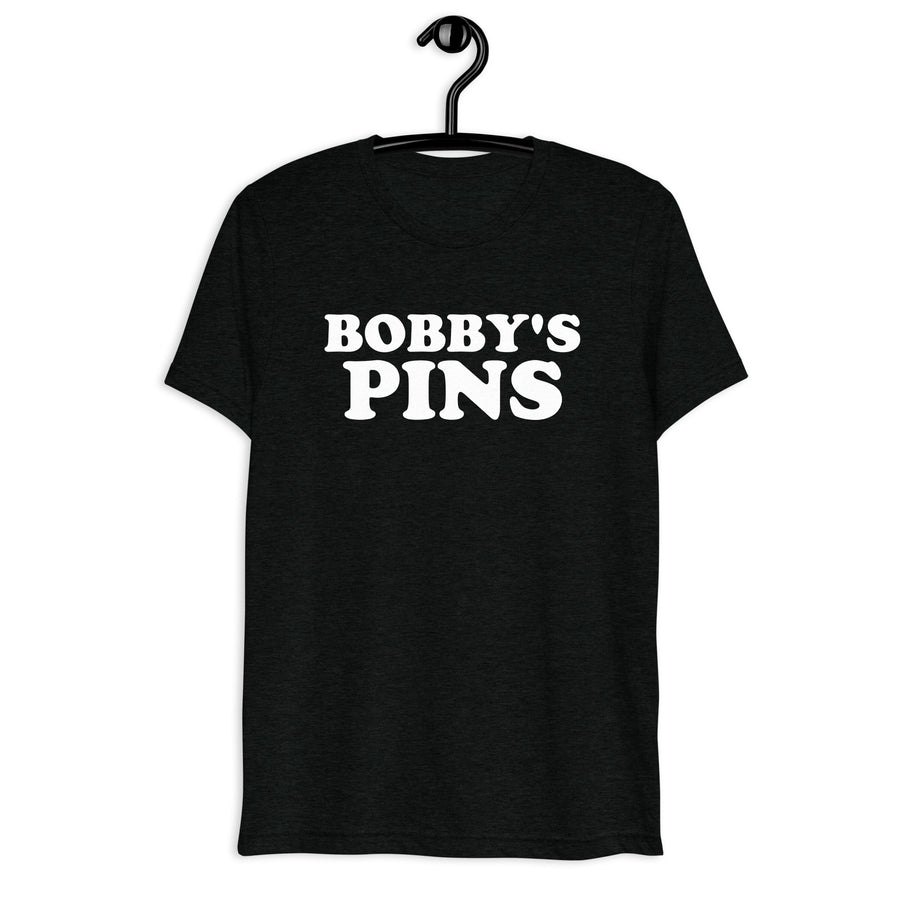 Front hanger mockup of the black tri-blend Bobby's Pins quote T-shirt