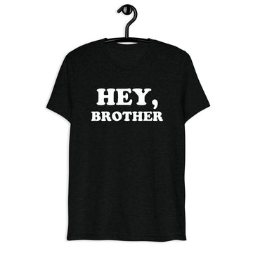 Front hanger mockup of black tri-blend T-shirt with Hey, Brother quote in white vintage lettering