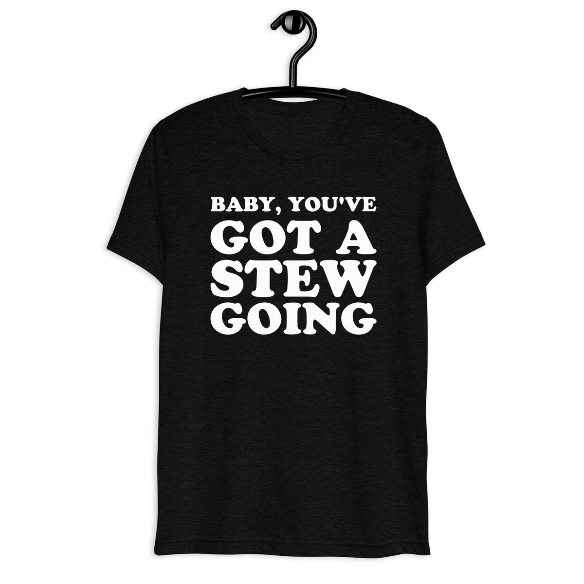 Front hanger mockup of the black tri-blend Baby, You've Got a Stew Going quote T-shirt