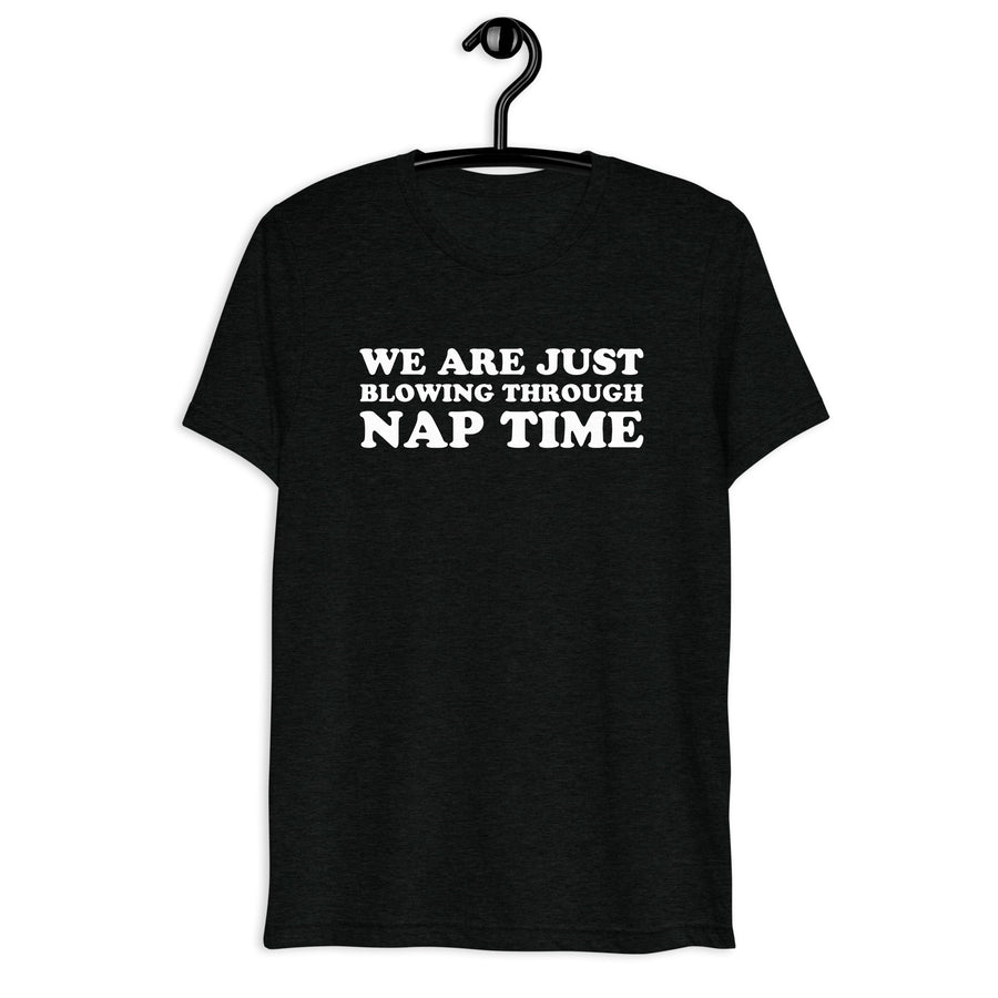 Front hanger view of black tri-blend quote shirt reading We Are Just Blowing Through Nap Time
