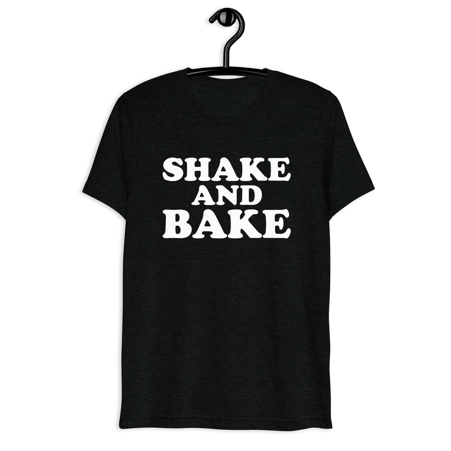 Front hanger view of black tri-blend quote shirt reading Shake and Bake