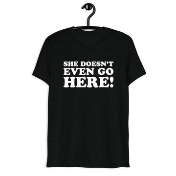 Front hanger view of black tri-blend quote shirt reading She Doesn't Even Go Here!