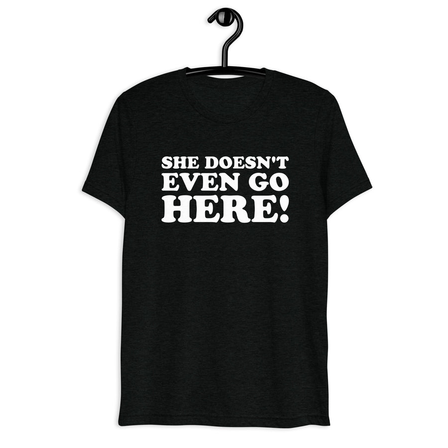 Front hanger view of black tri-blend quote shirt reading She Doesn't Even Go Here!