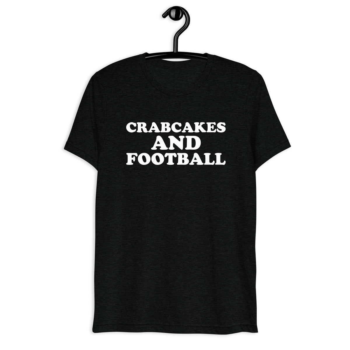 Front hanger view of black tri-blend quote shirt reading Crabcakes and Football