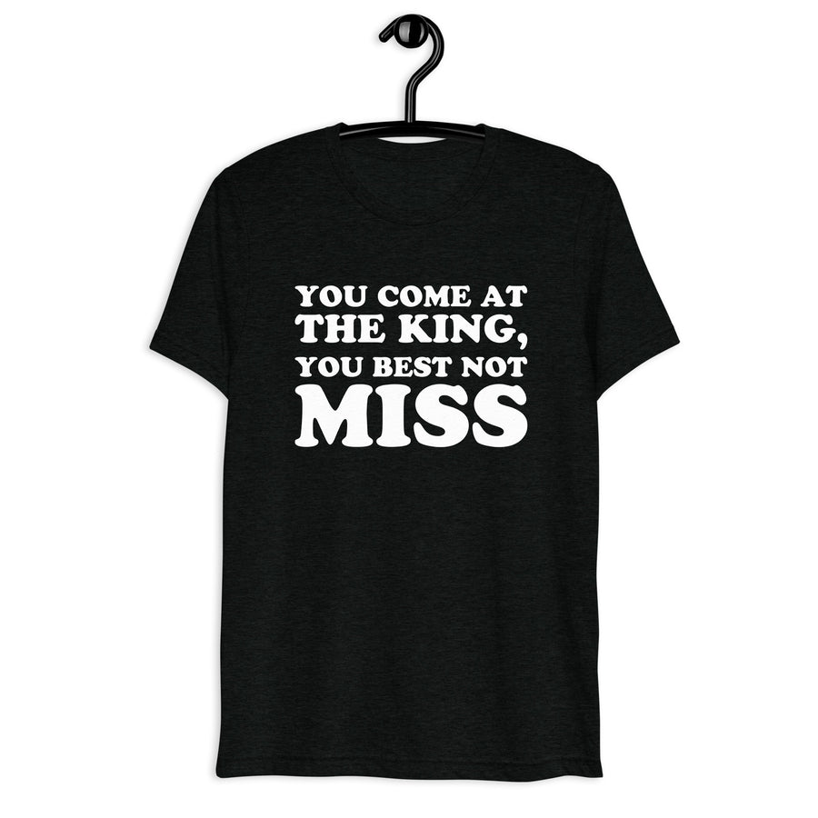 Front hanger mockup of the black tri-blend You Come at the King, You Best Not Miss quote T-shirt