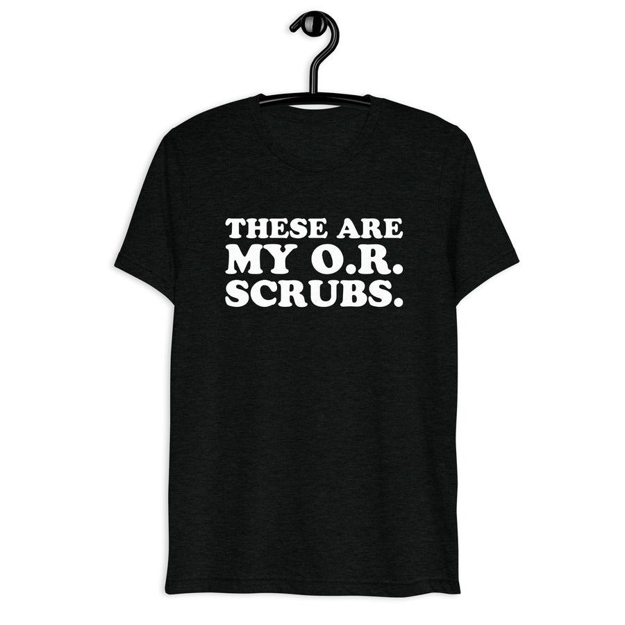 Front hanger view of black tri-blend quote shirt reading These Are My O.R. Scrubs.