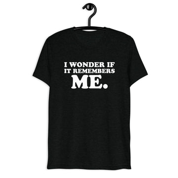 Front hanger view of black tri-blend quote shirt reading I Wonder If It Remembers Me.