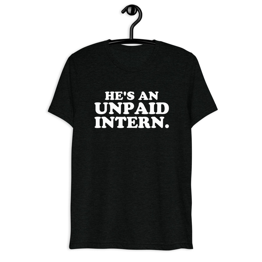 Front hanger view of black tri-blend quote shirt reading He's an Unpaid Intern.