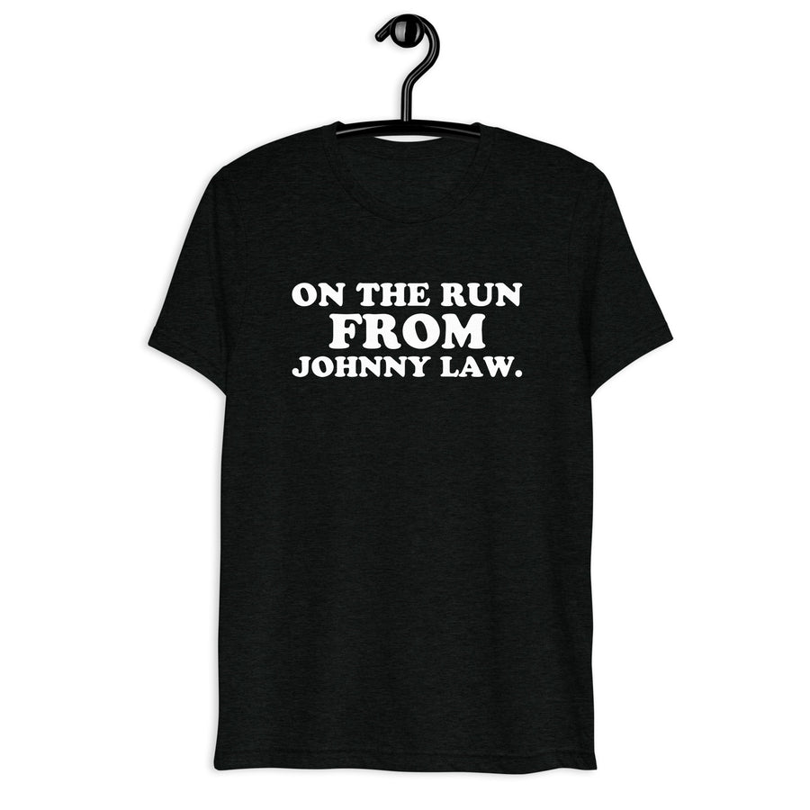 Front hanger view of black tri-blend quote shirt reading On the Run from Johnny Law.