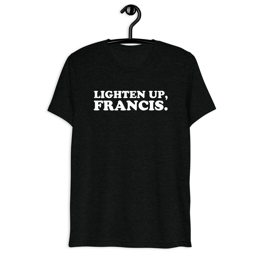 Front hanger view of black tri-blend quote shirt reading Lighten Up, Francis.