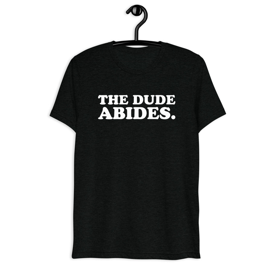 Front hanger view of black tri-blend quote shirt reading The Dude Abides.