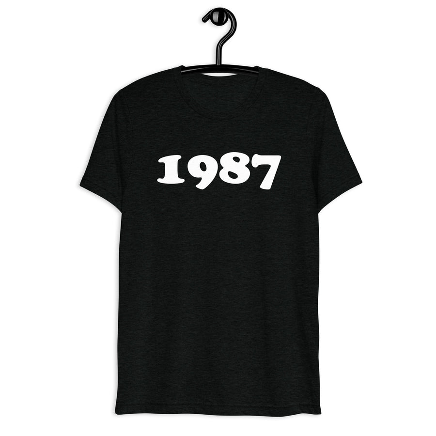 Front hanger view of black tri-blend 1987 Retro Year T-Shirt