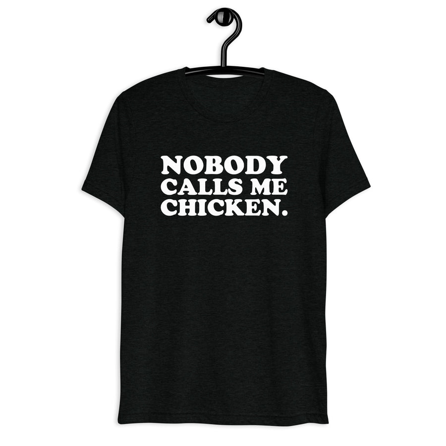 Front hanger view of black tri-blend quote shirt reading Nobody Calls Me Chicken.