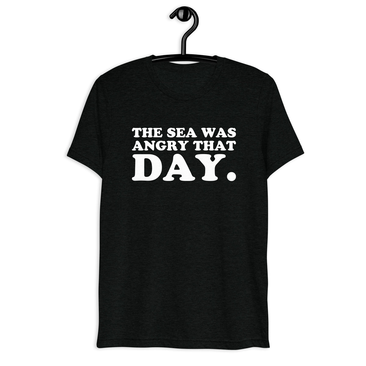 Front hanger view of black tri-blend quote shirt reading The Sea Was Angry That Day.