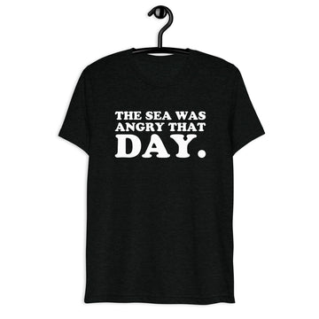 Front hanger view of black tri-blend quote shirt reading The Sea Was Angry That Day.