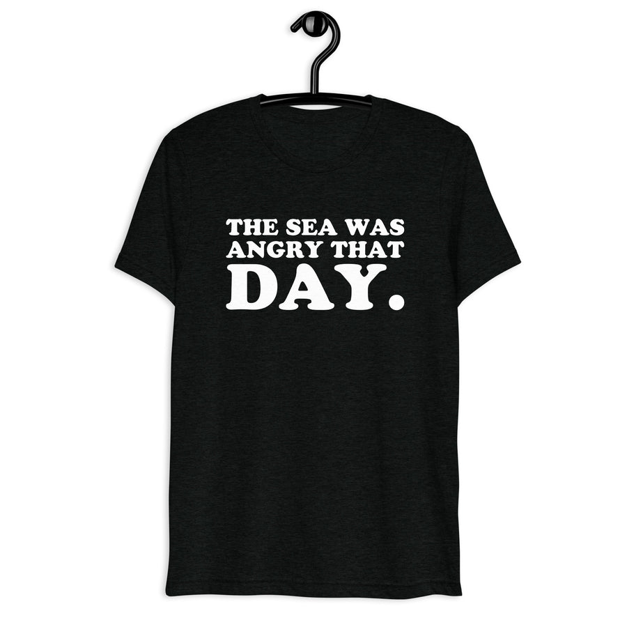 Front hanger view of black tri-blend quote shirt reading The Sea Was Angry That Day.