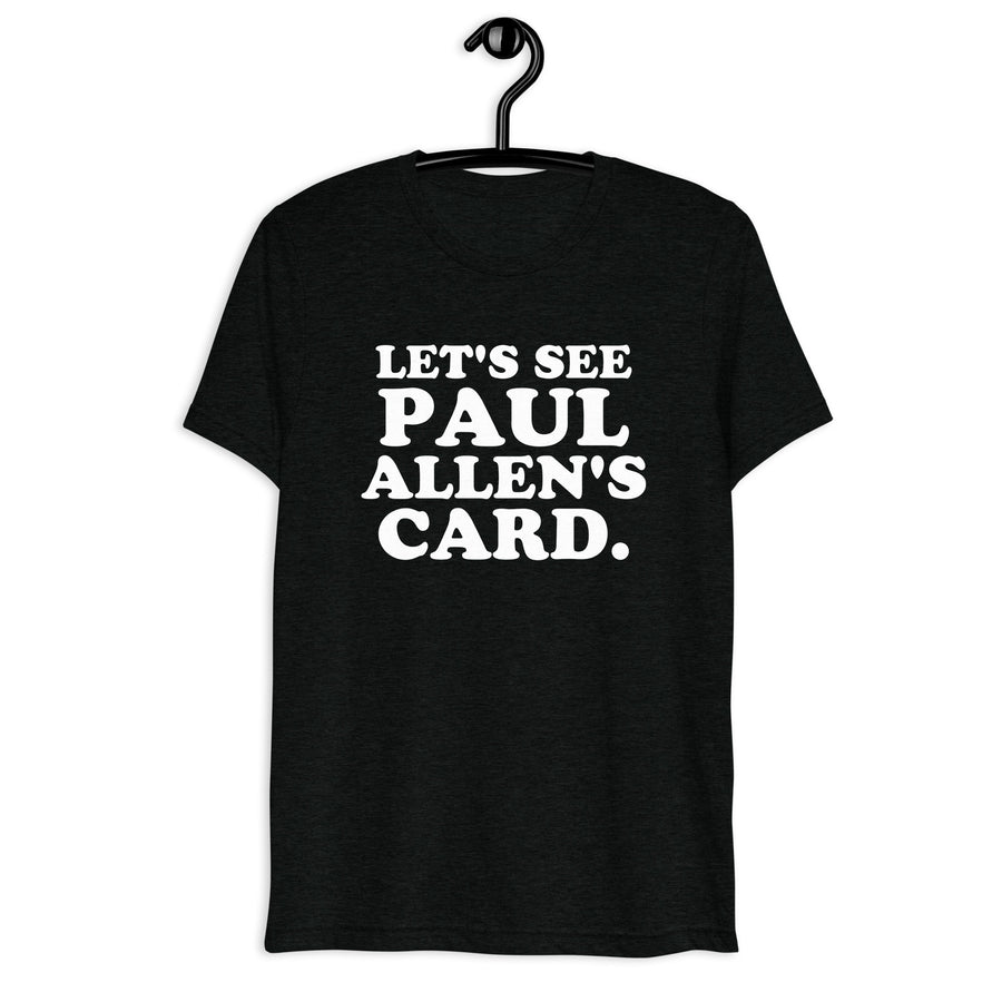 Front hanger view of black tri-blend quote shirt reading Let's See Paul Allen's Card