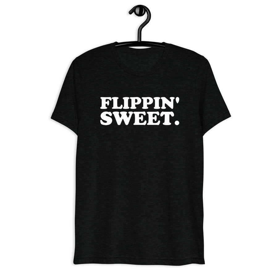 Flippin' Sweet. white quote print on a black tri-blend T-shirt, front hanger view
