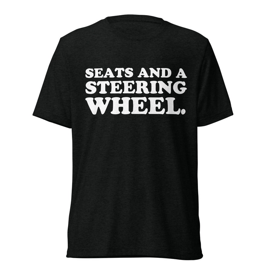 Front hanger view of black tri-blend quote shirt reading Seats and a Steering Wheel